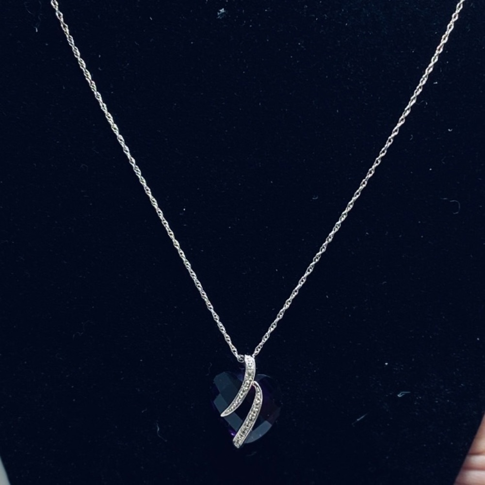 Sterling silver necklace with natural amethyst heart pendant.